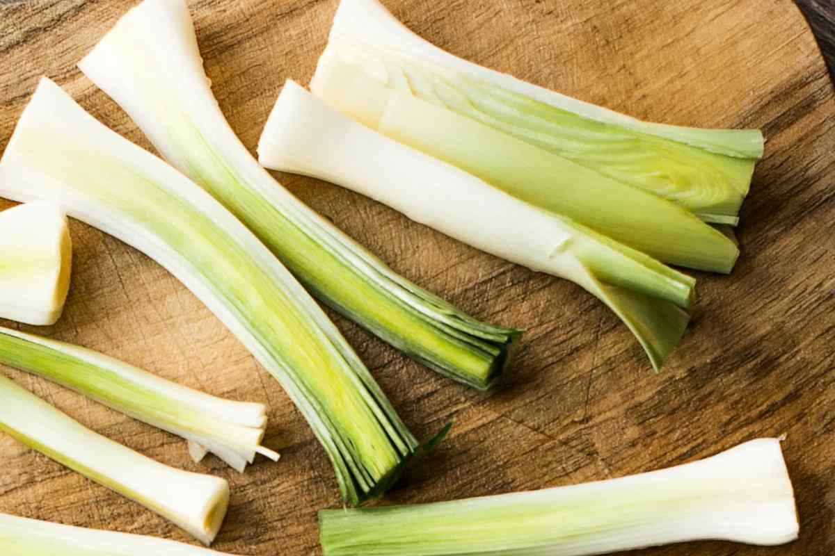 Image of some leeks sliced lengthways with ends removed, this is part of a blog about making a leek and cheese pasta recipe with kids